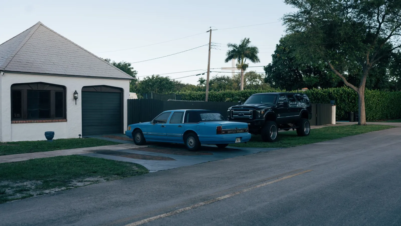 Sedan parked on a residential street in a small American town