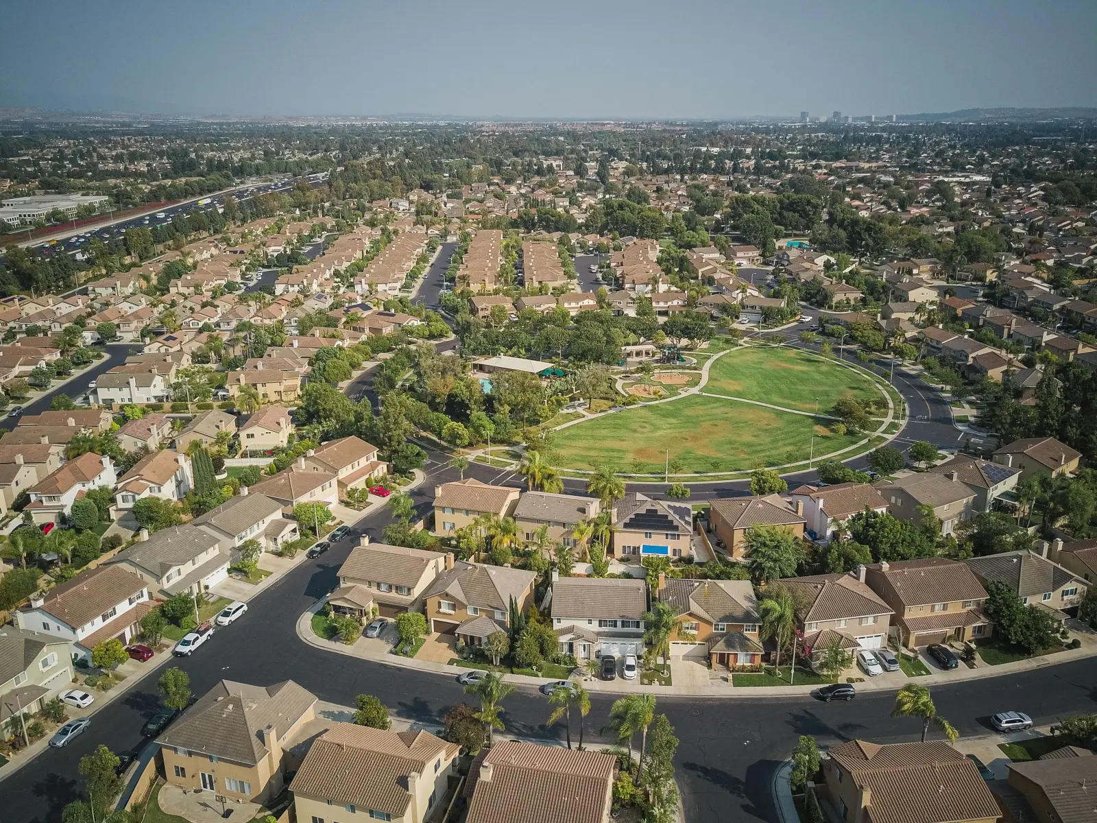 Aerial view of a residential neighborhood with rows of single-family homes