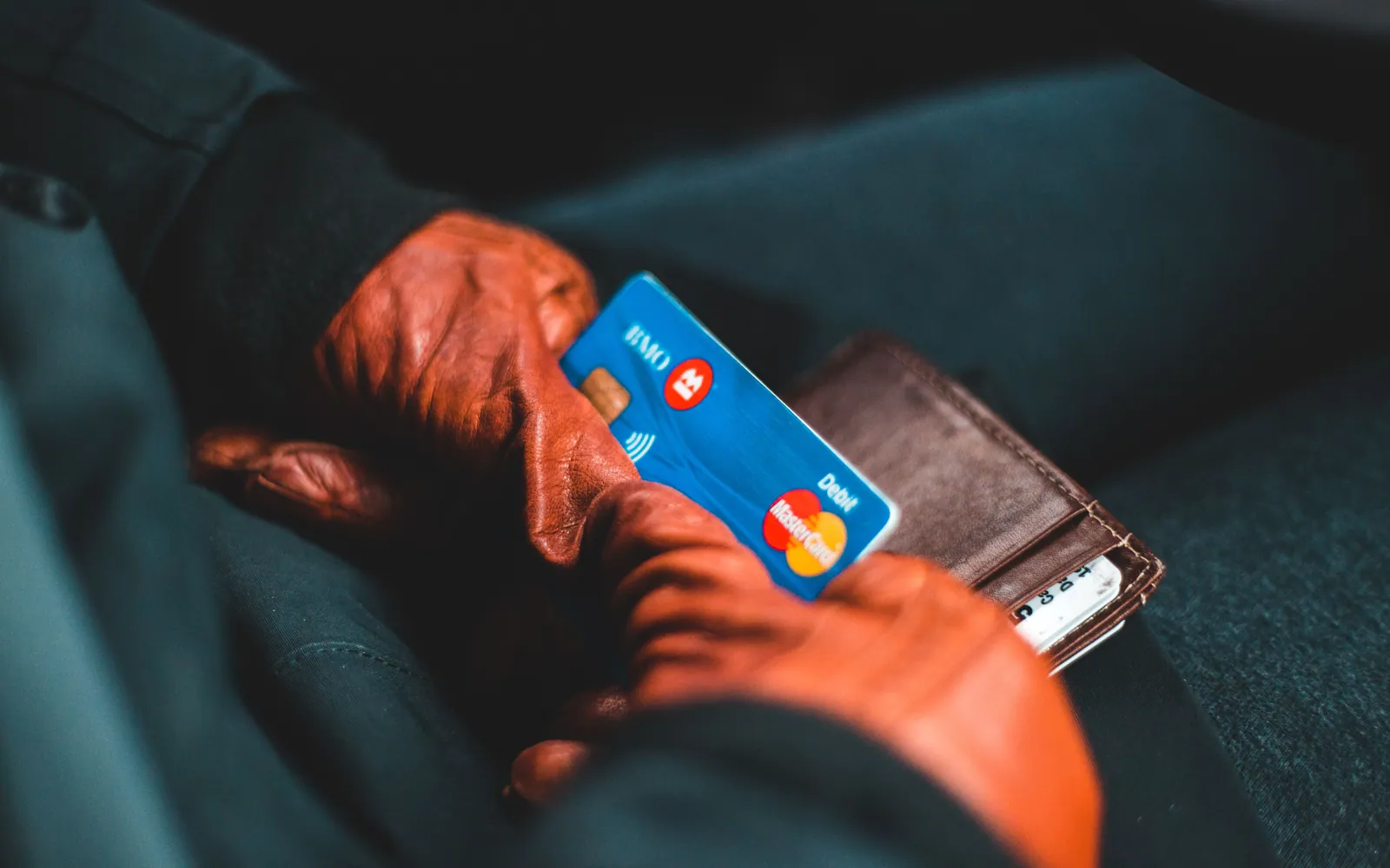 Hand holding several credit cards