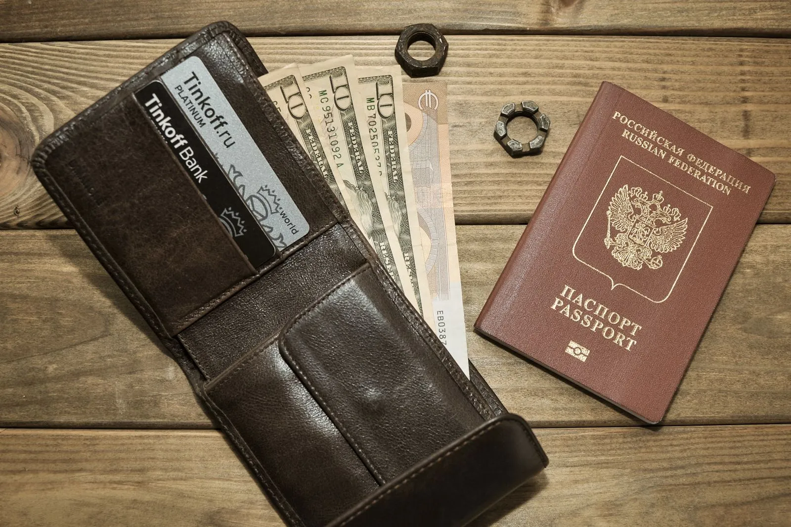 Leather wallet with cash and a passport, ready for travel