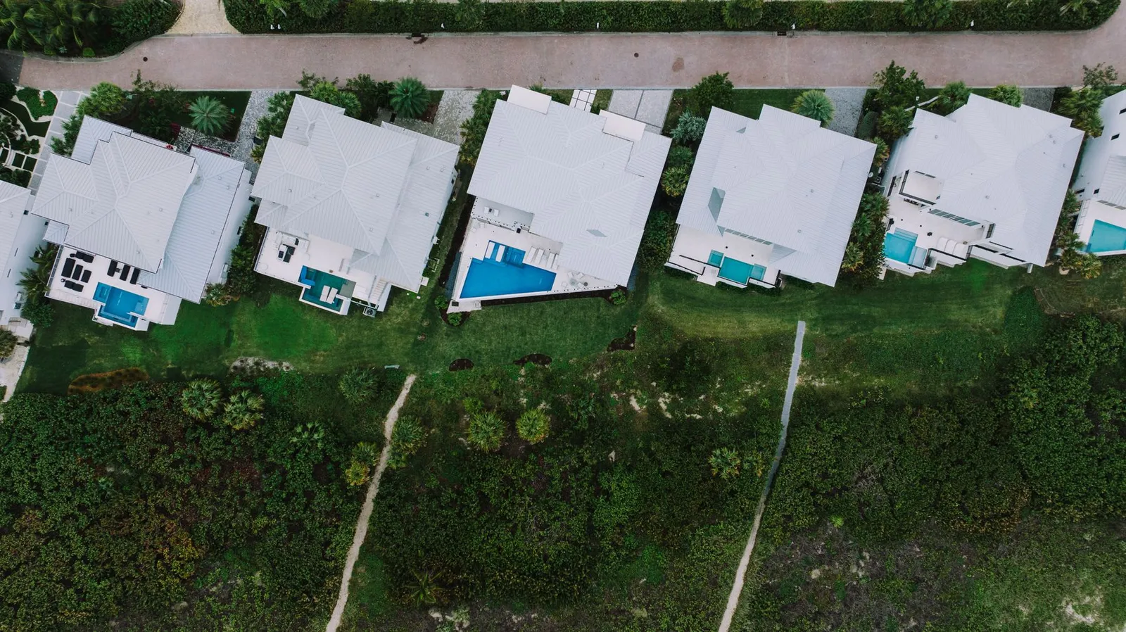 Aerial view of a Florida residential neighborhood with backyard pools