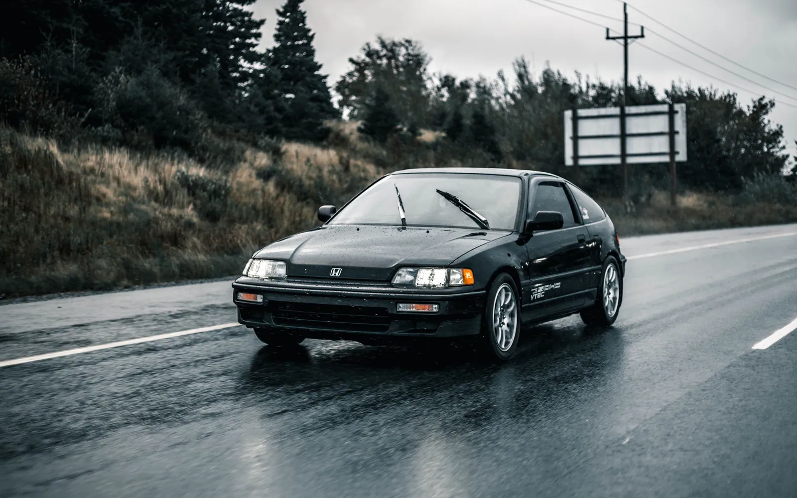 Car driving in the rain