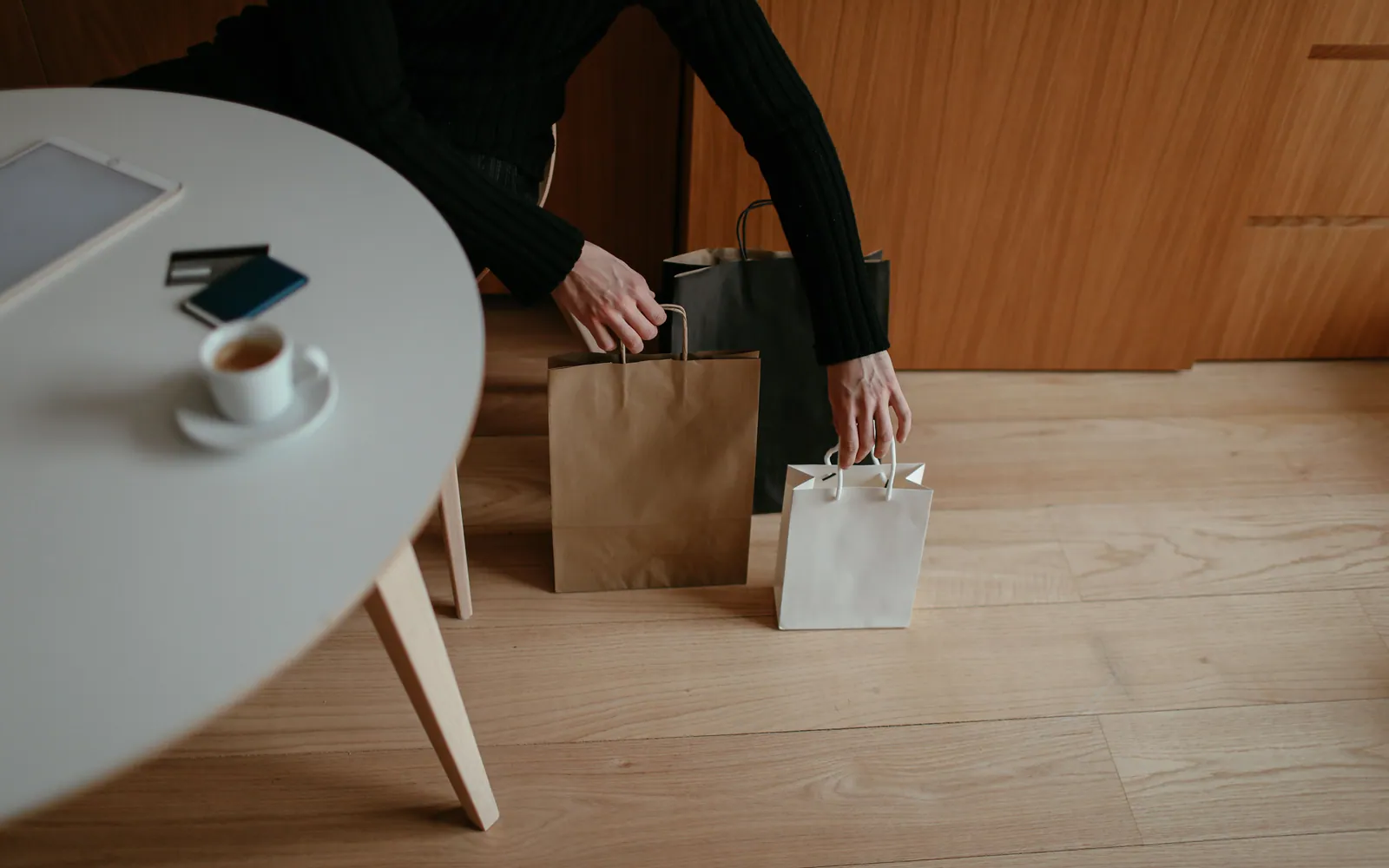 A credit card beside shopping bags