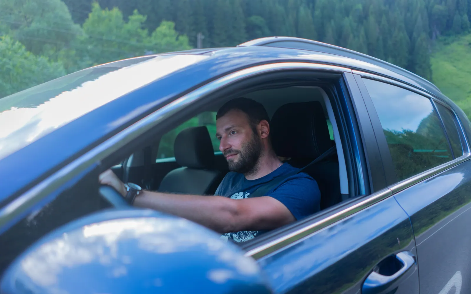 Driver smiling behind the wheel