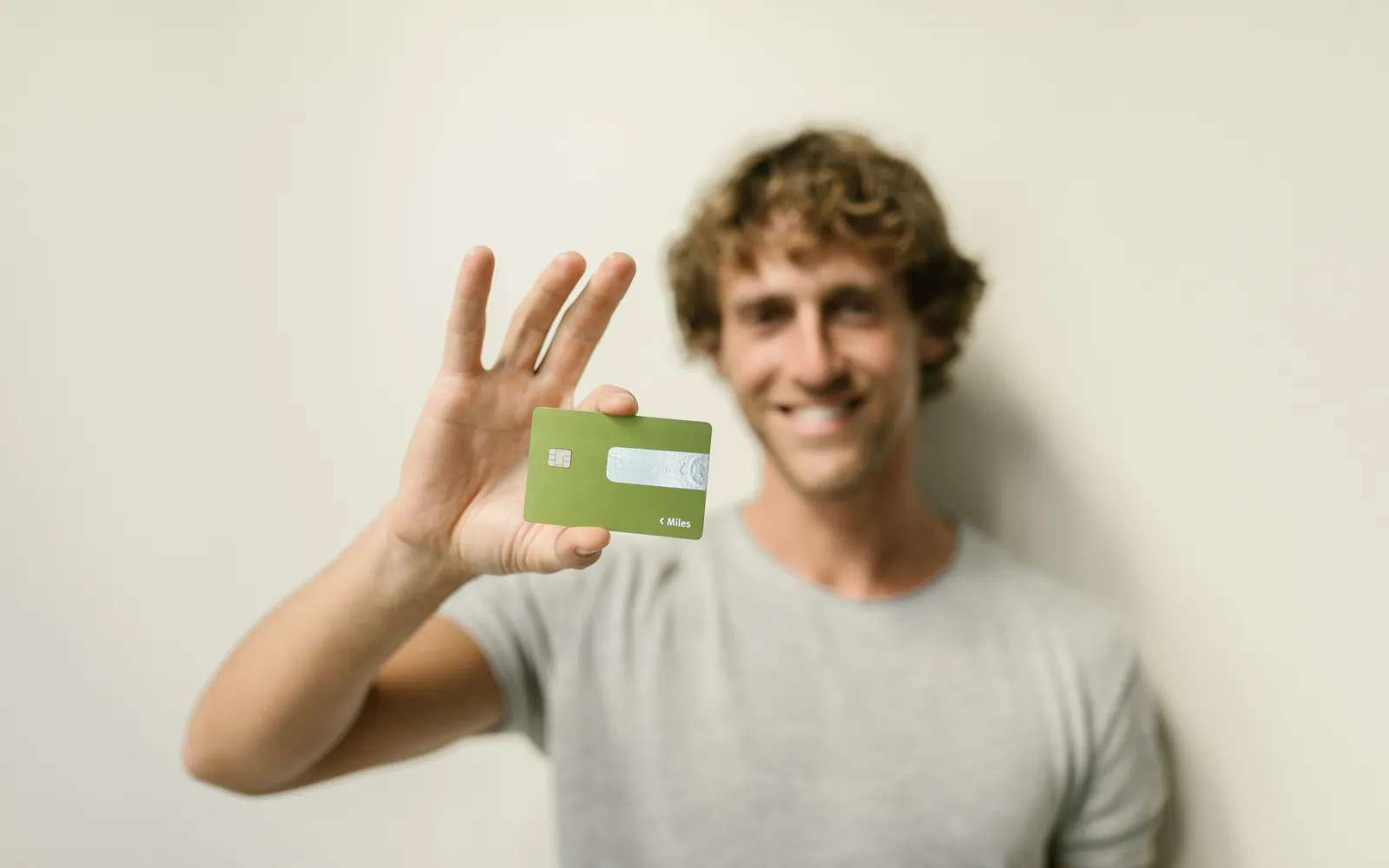 Young person holding a credit card