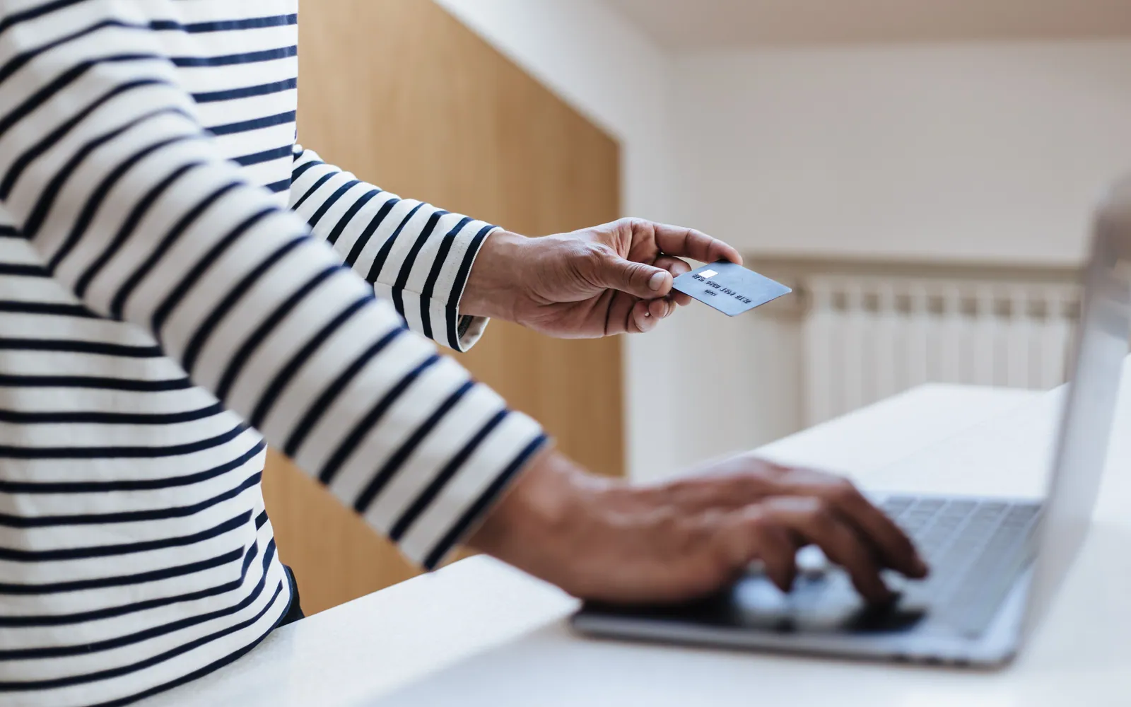 Person shopping online with a credit card