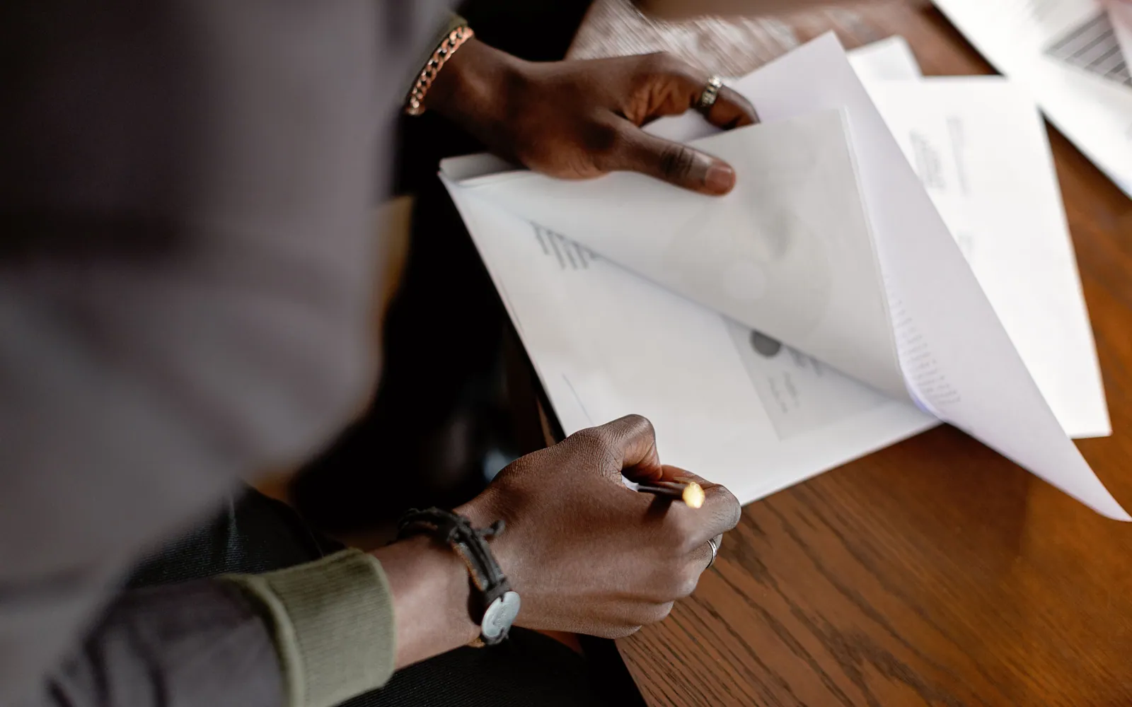 Student reviewing paperwork at a desk