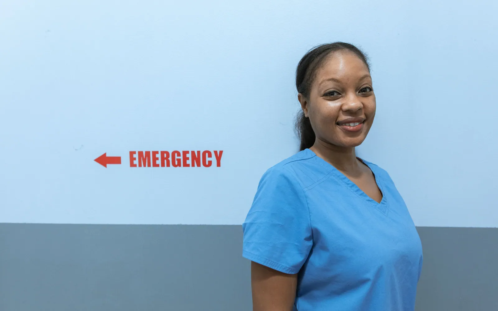 Nurse in scrubs in a hospital