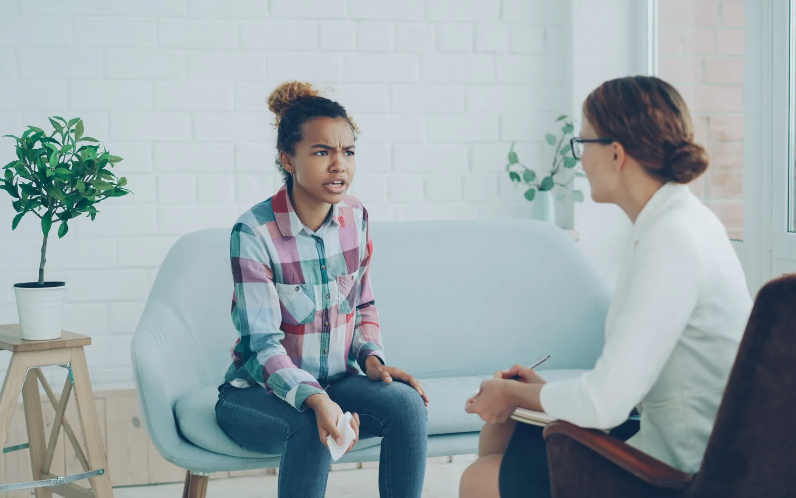 Two people talking in a counseling session