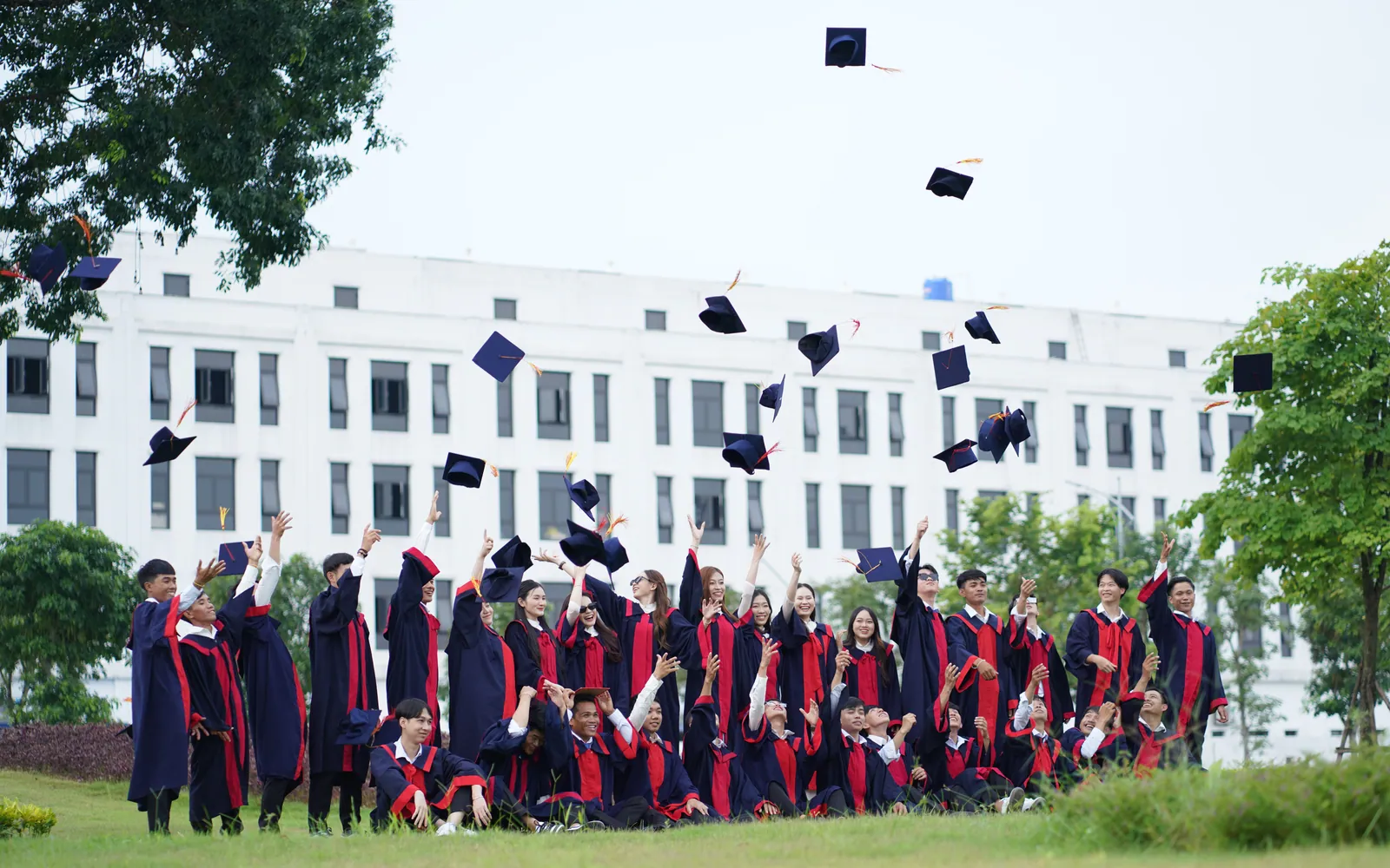 Graduates throwing their caps in celebration