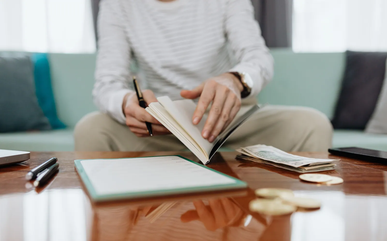 Person reviewing bills at home
