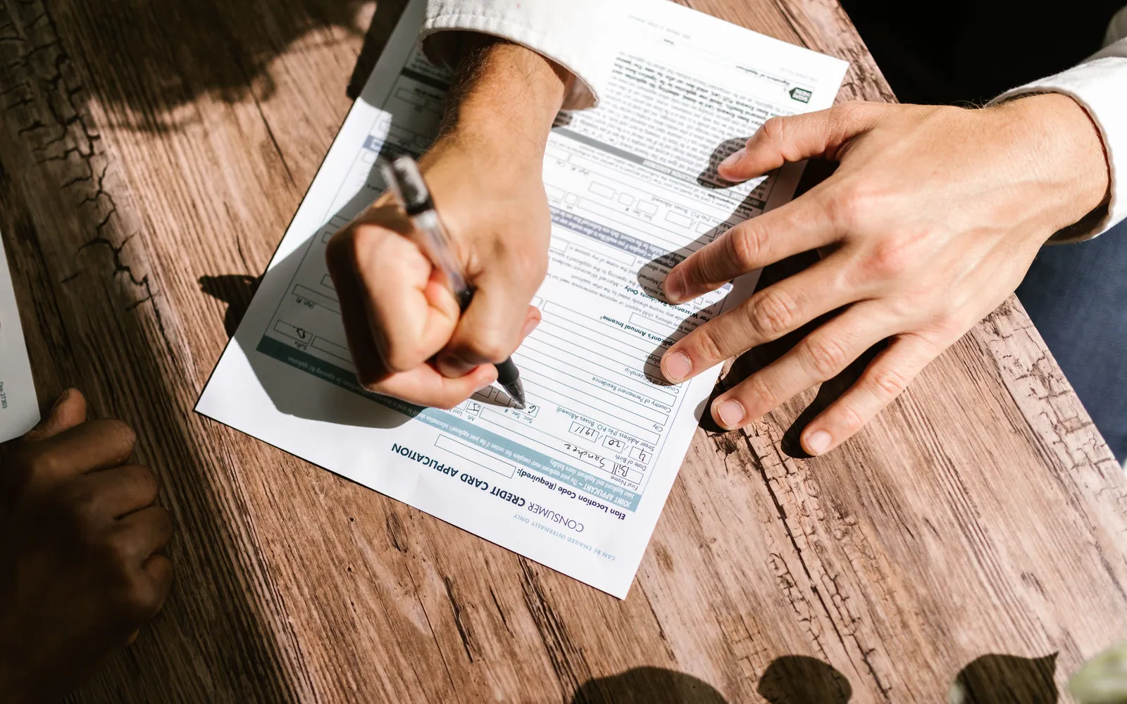 Person filling out a loan application