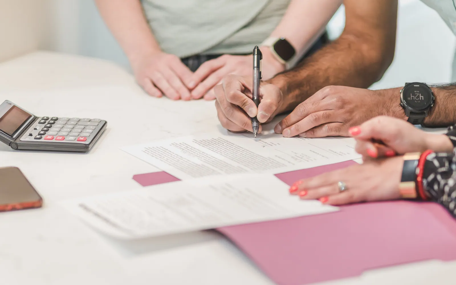 Person signing loan paperwork