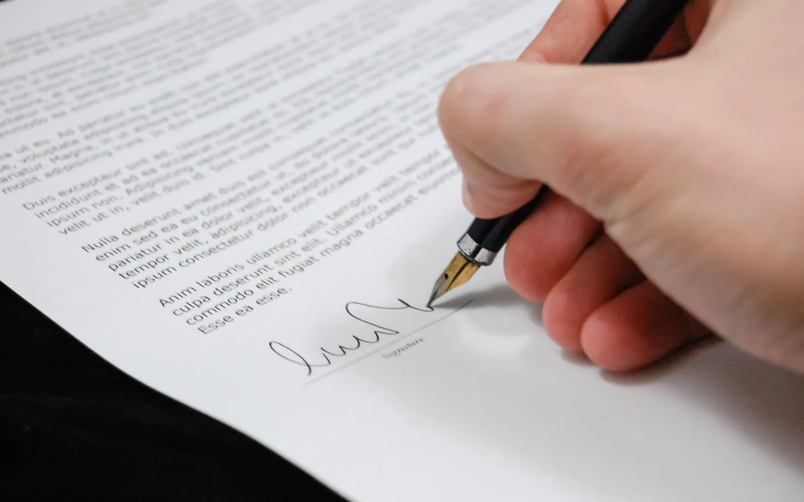 Signing closing documents with a pen