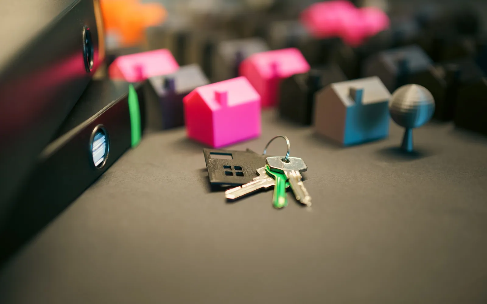 Model house and keys on a table