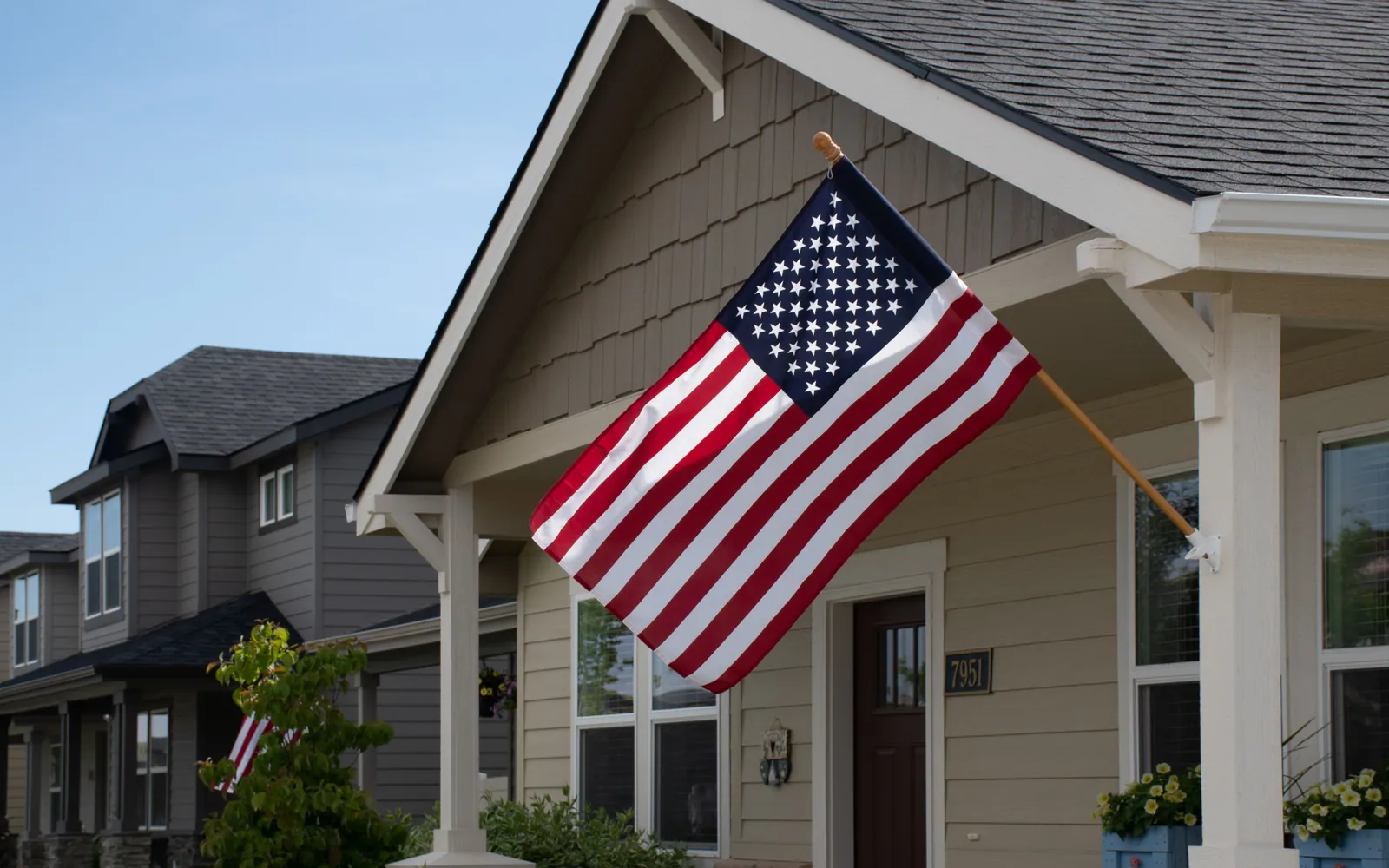 American flag on a house porch