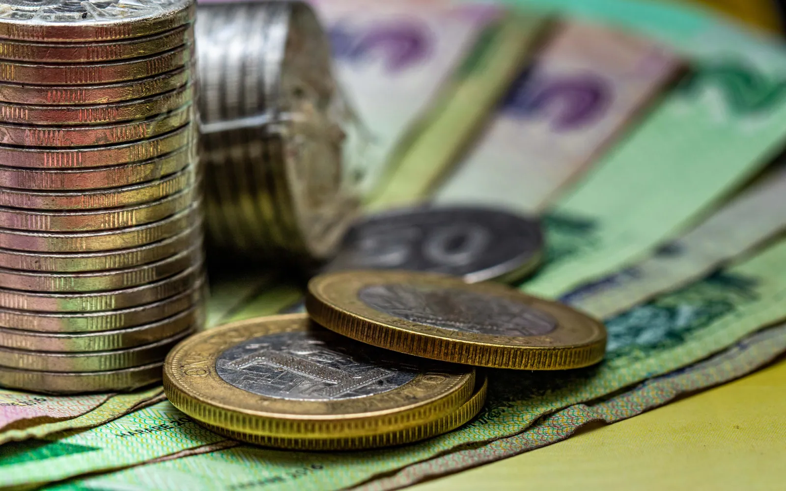 Coins stacked in rising piles