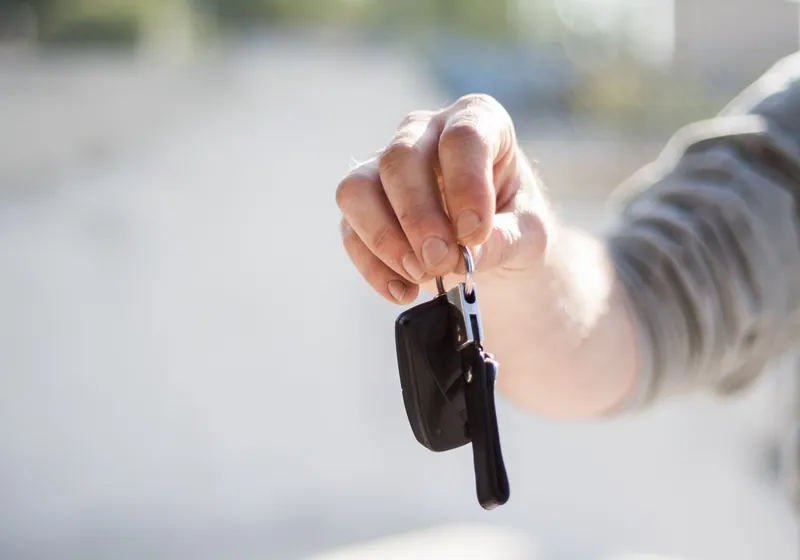 Young driver with car keys