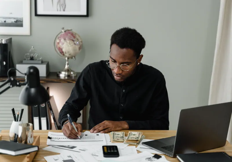 Person using laptop for finances