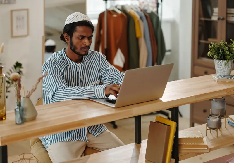 Person reviewing loan options on a laptop