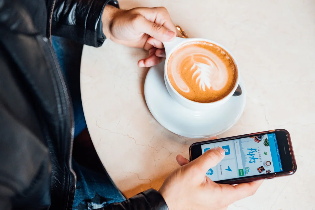 Person reviewing savings on phone