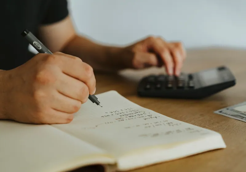 Person working out savings interest at a desk