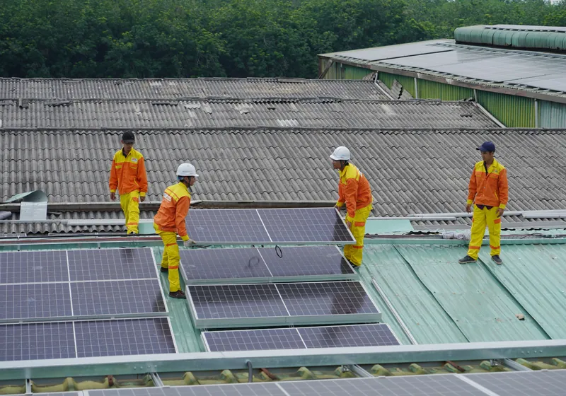 Solar installation crew on roof